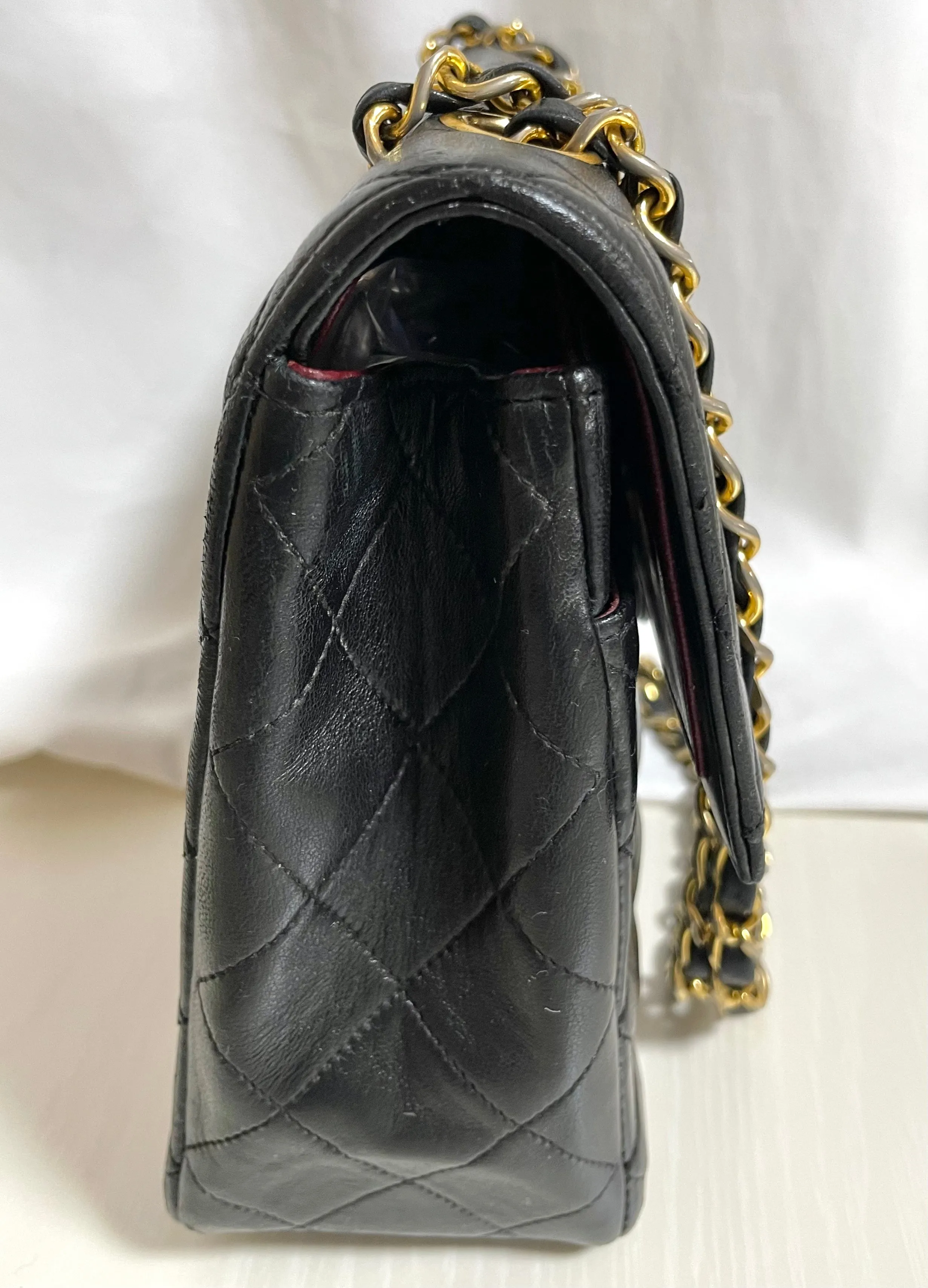80's vintage Chanel black 2.55 shoulder bag with circle CC  flap design. Rare piece from the era. 0410283