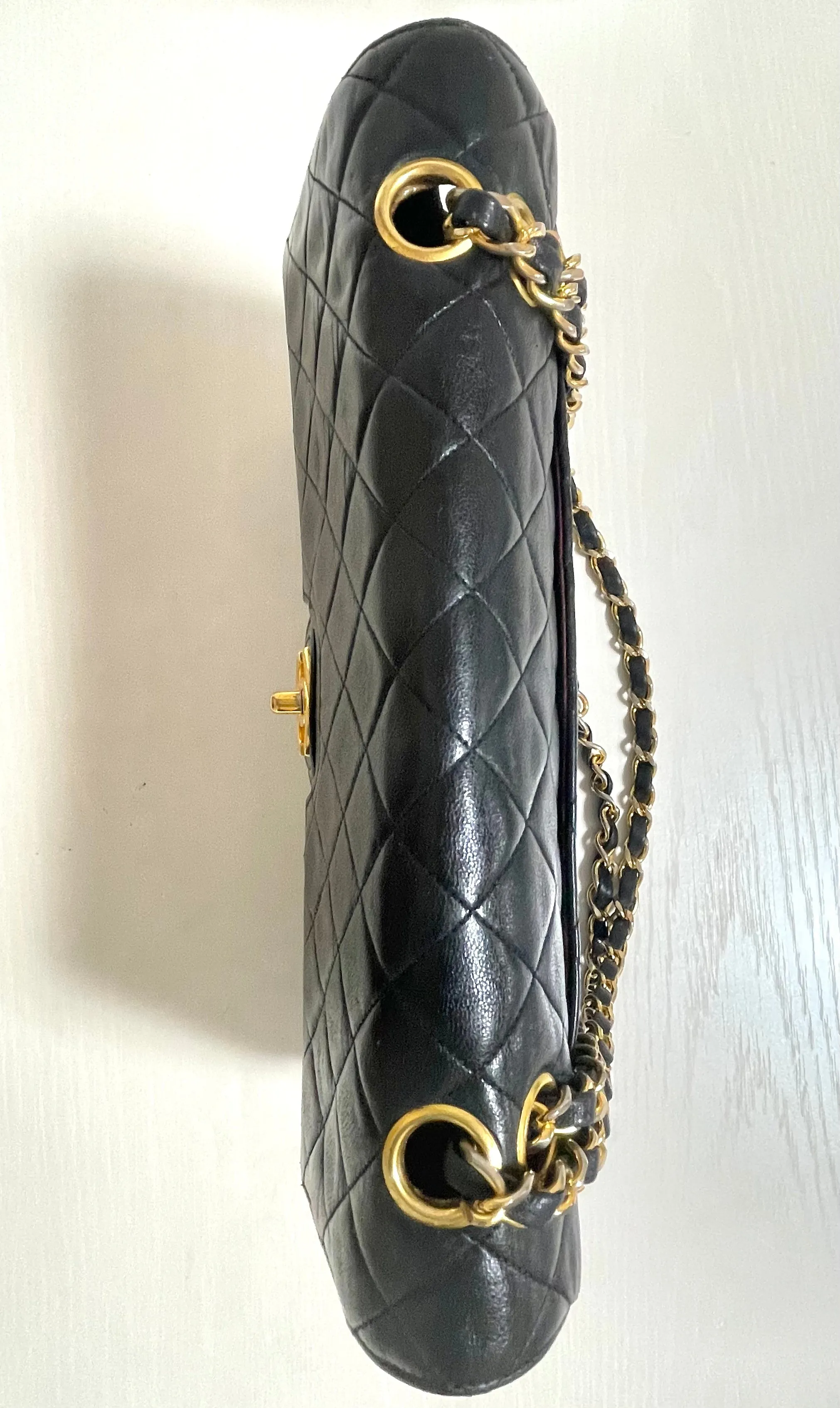 80's vintage Chanel black 2.55 shoulder bag with circle CC  flap design. Rare piece from the era. 0410283