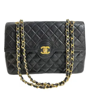 80's vintage Chanel black 2.55 shoulder bag with circle CC  flap design. Rare piece from the era. 0410283