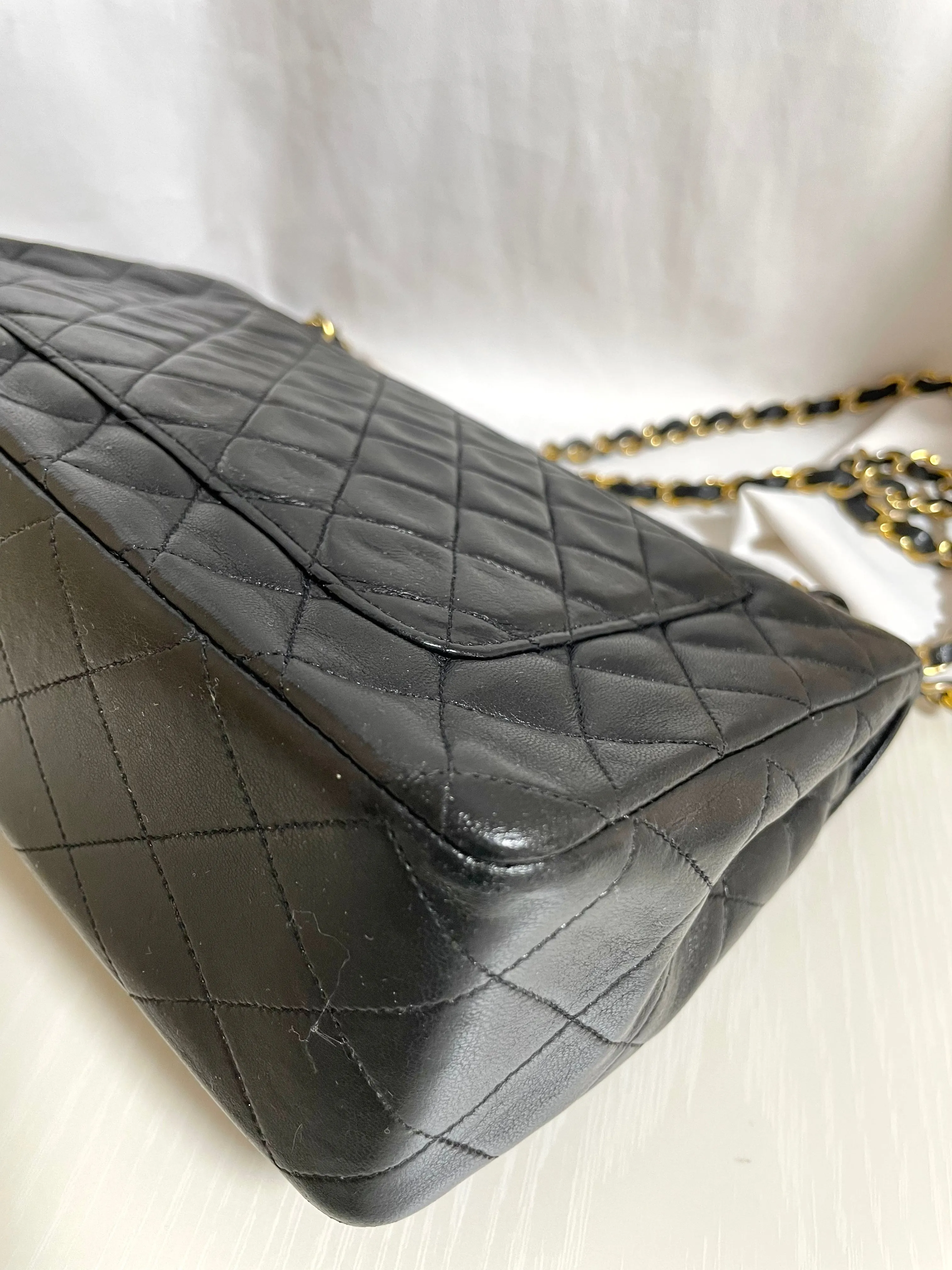 80's vintage Chanel black 2.55 shoulder bag with circle CC  flap design. Rare piece from the era. 0410283