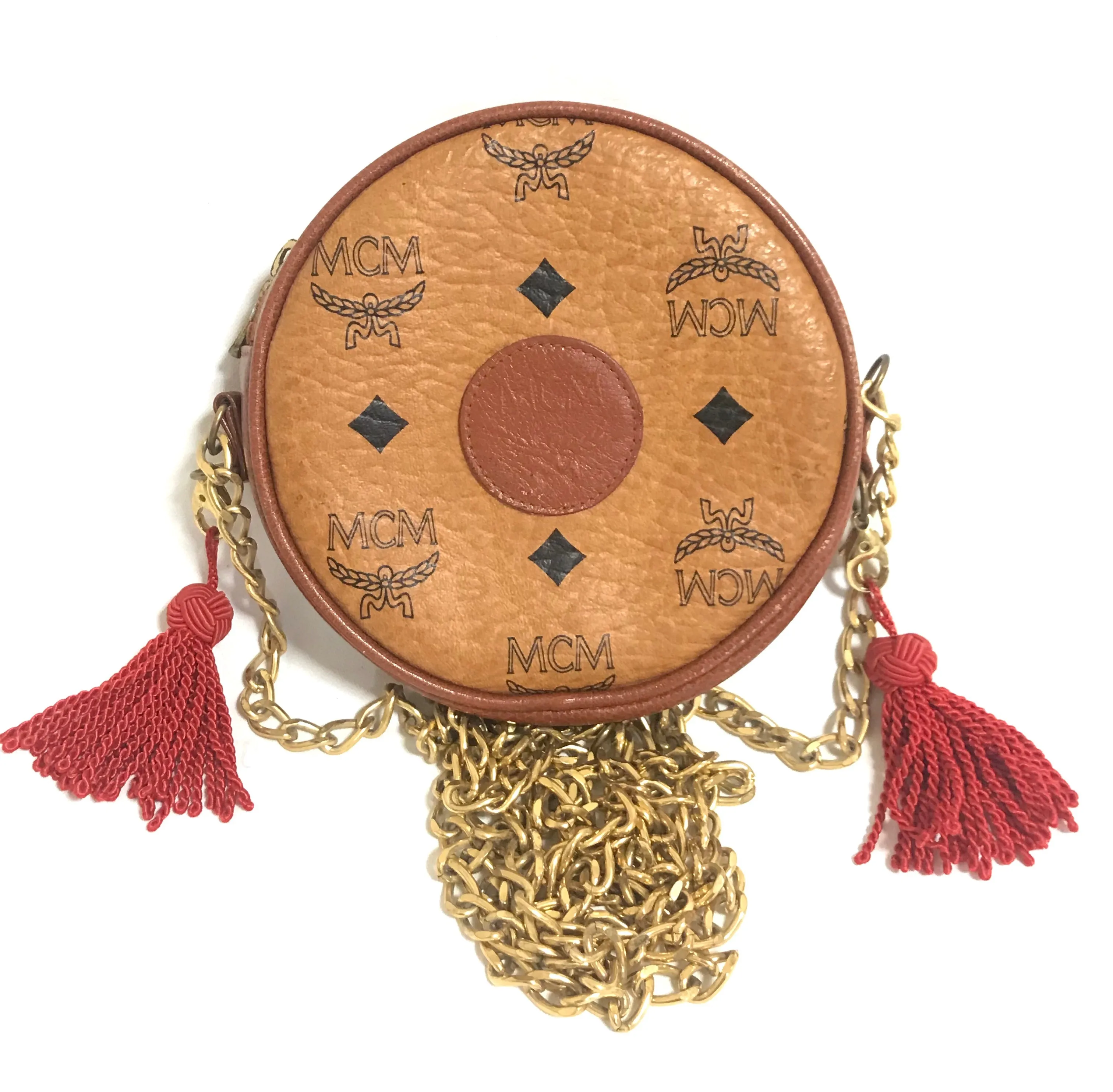 Vintage MCM brown monogram mini Suzy Wong chain shoulder purse with red fringes. Designed by Michael Cromer. Rare purse.
