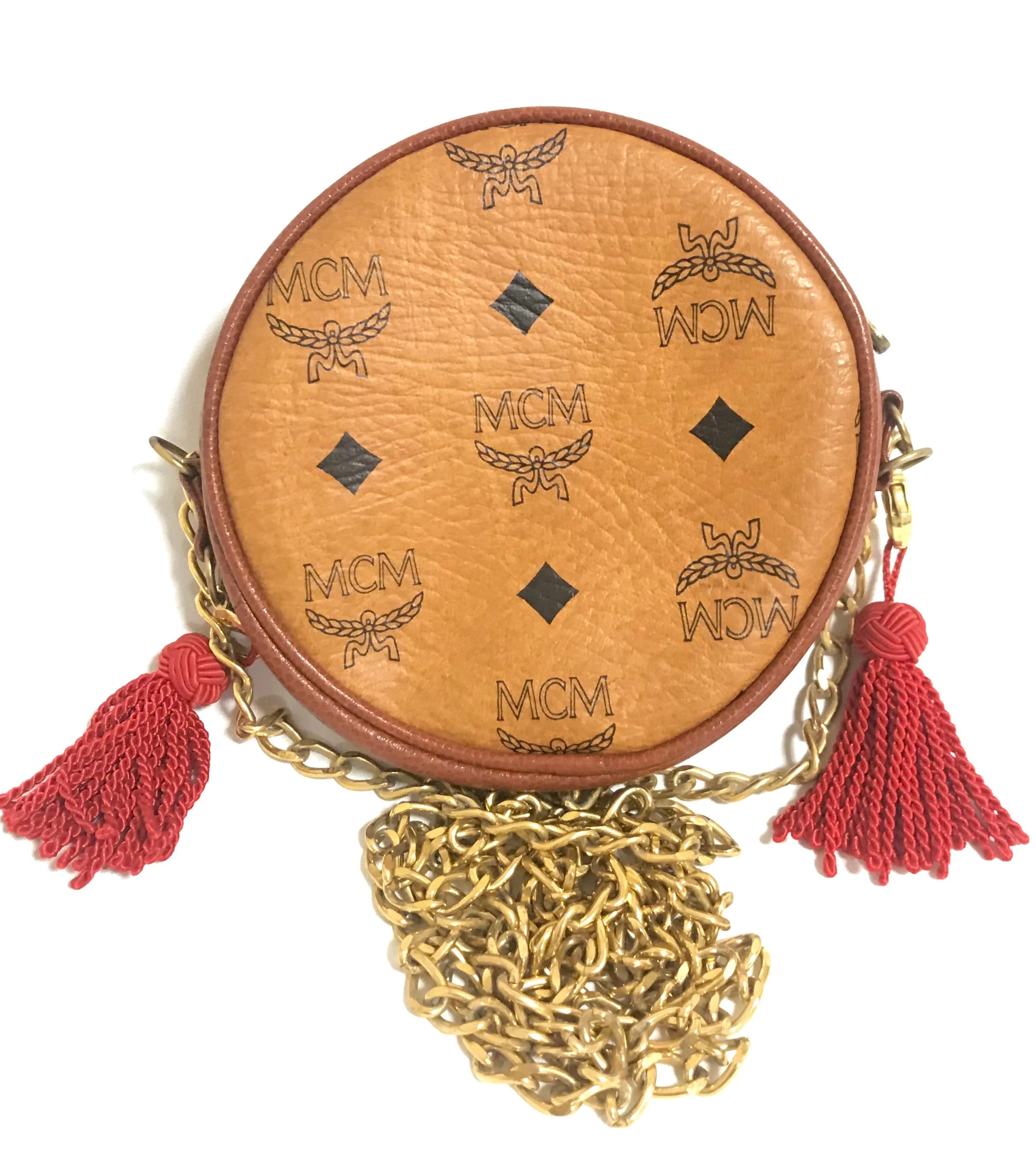 Vintage MCM brown monogram mini Suzy Wong chain shoulder purse with red fringes. Designed by Michael Cromer. Rare purse.