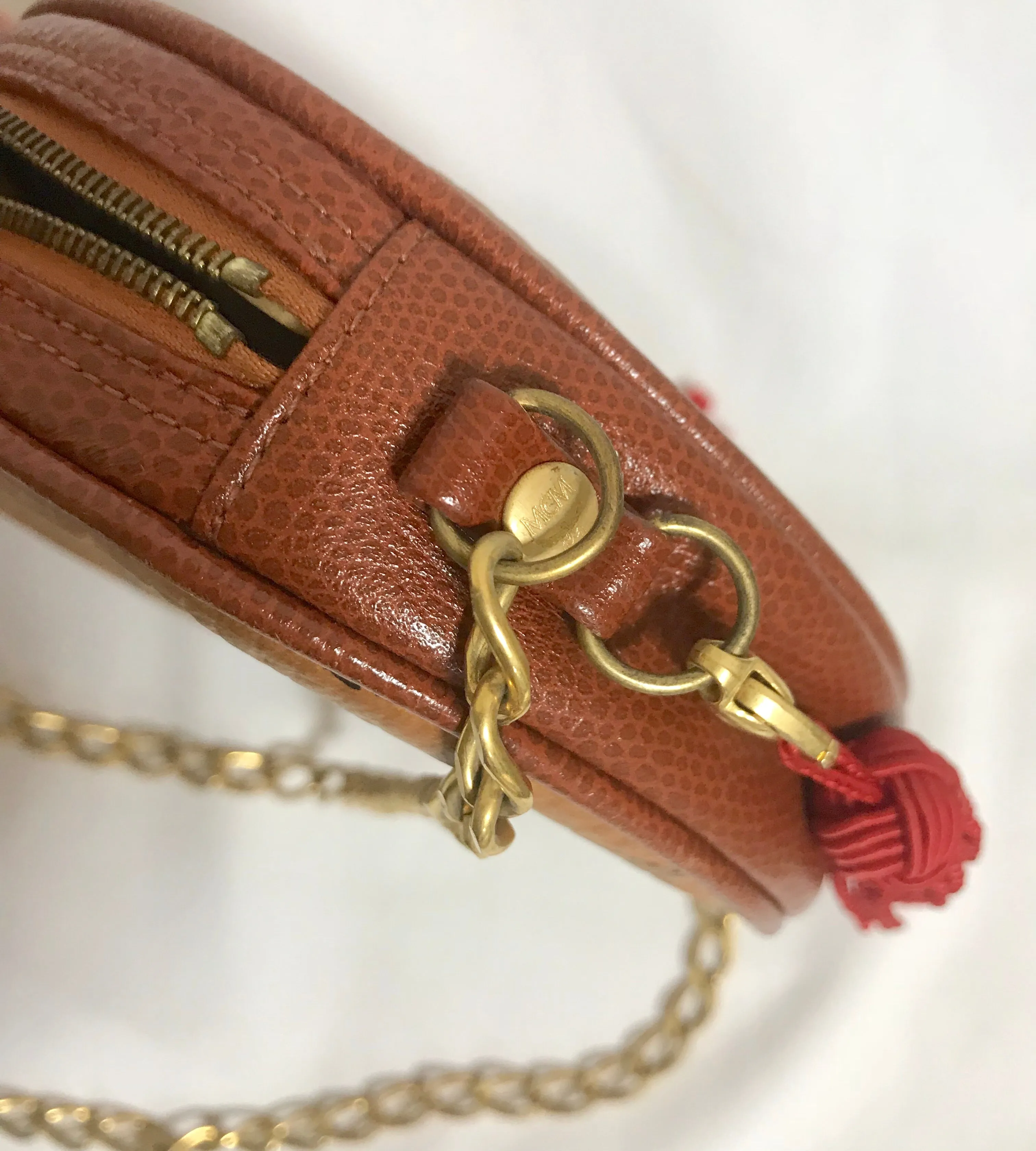 Vintage MCM brown monogram mini Suzy Wong chain shoulder purse with red fringes. Designed by Michael Cromer. Rare purse.