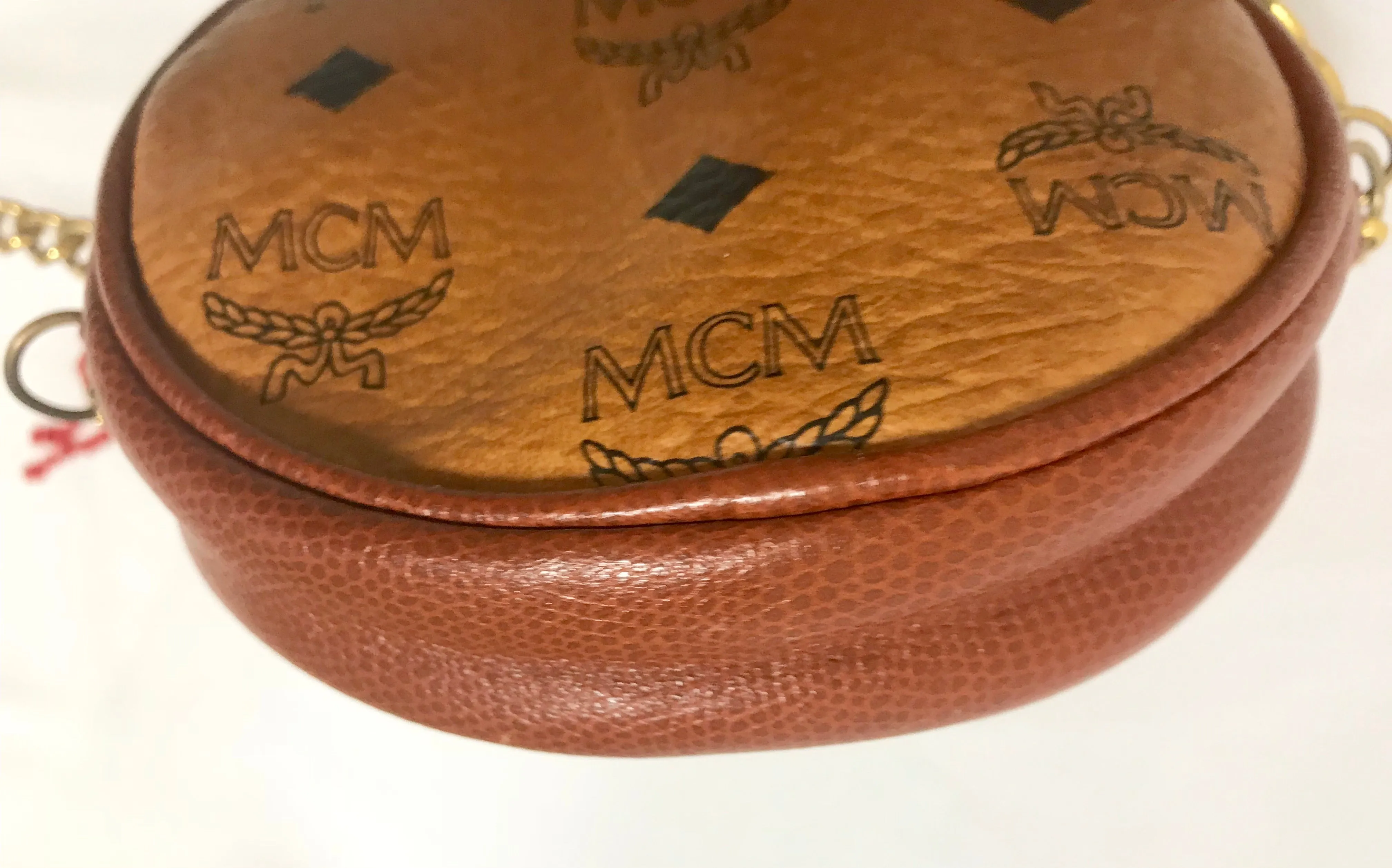 Vintage MCM brown monogram mini Suzy Wong chain shoulder purse with red fringes. Designed by Michael Cromer. Rare purse.